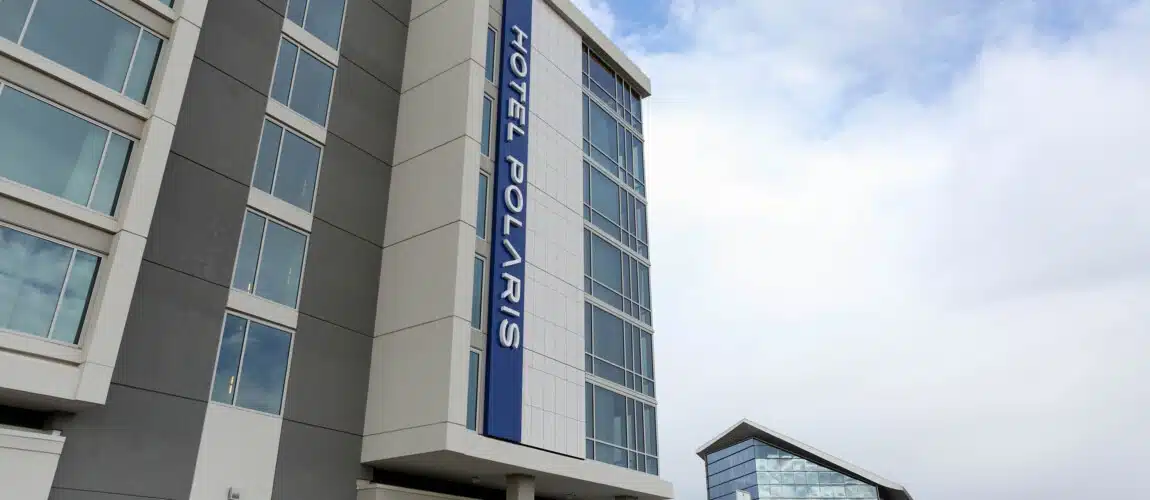 Hotel Polaris building with blue sky backdrop